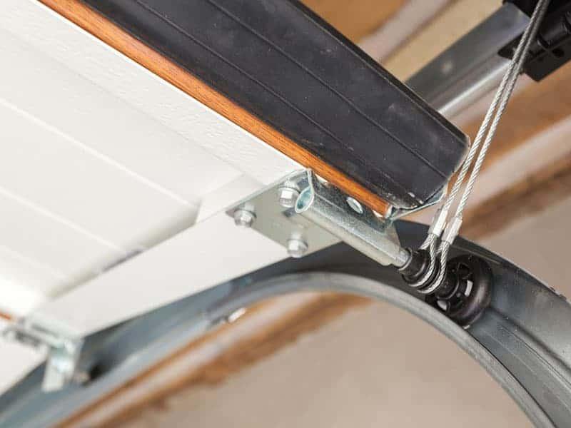 the roller of a garage door that looks well maintained, unlikely to suffer from any common garage door problems.