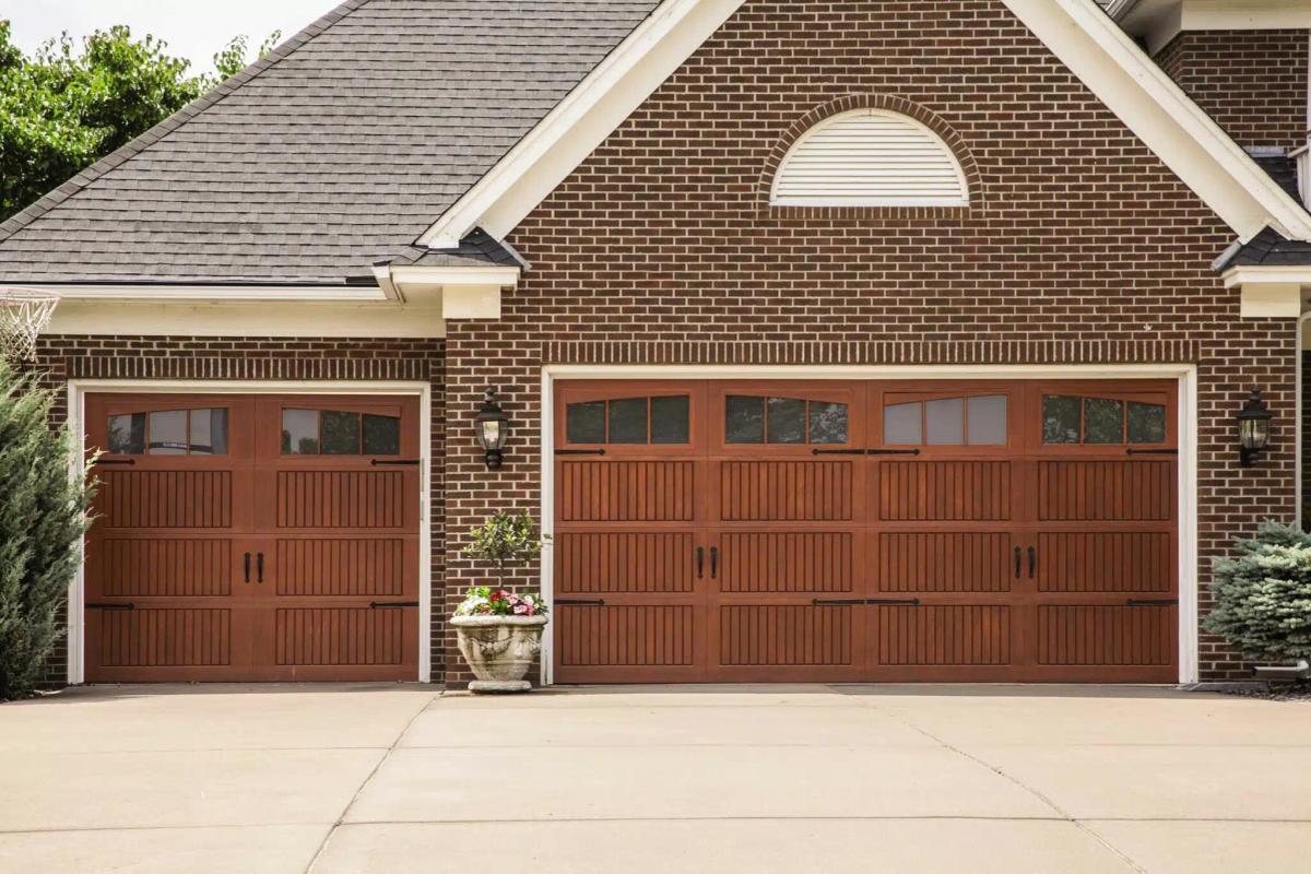 Brick house with a brown garage door, potentially with a common garage door problem